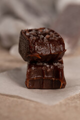 Handmade toffee, bitter chocolate with salt, close-up