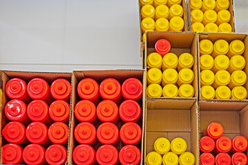 multicolored plastic containers for sauces, mayonnaise, ketchup and other liquids