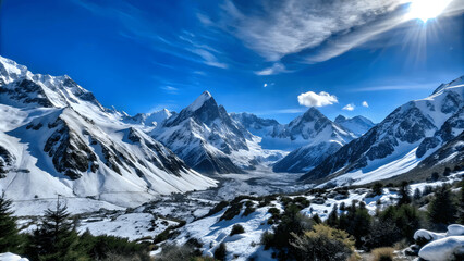 Obraz premium A panoramic view of a snowy mountain range under a clear blue sky