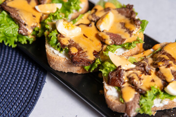 bruschetta with grilled beef salad and sauce 