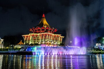 Sarawak Legislative Assembly New Building view at the bank of Sarawak river fountain show at night...