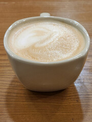 Ceramic cup with hot coffee. Cup of coffee on the table