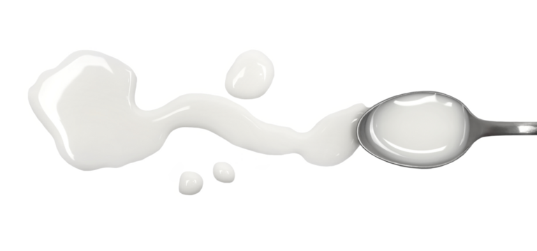 Spilled milk puddle with metal spoon isolated on white background and texture, top view
