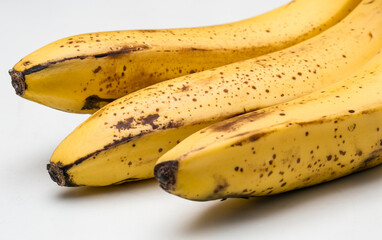 Collection of three ripe yellow bananas