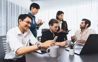 Group of diverse office worker employee working together on strategic business marketing planning in corporate office room. Positive teamwork in business workplace concept. Prudent