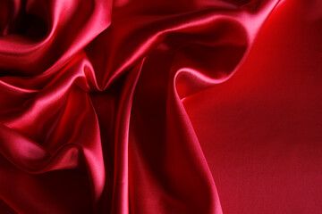 Ripples in red silk fabric