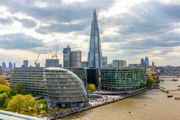 Shard skyscraper and City Hall building in Southwark along Thames river, London, UK