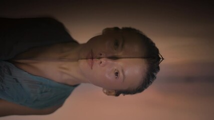 A stunning portrait of a young woman captured in artistic lighting