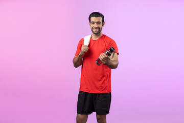 Full body length gaiety shot athletic and sporty young man with towel and drinking water in fitness exercise posture on isolated background. Healthy active and body care lifestyle.