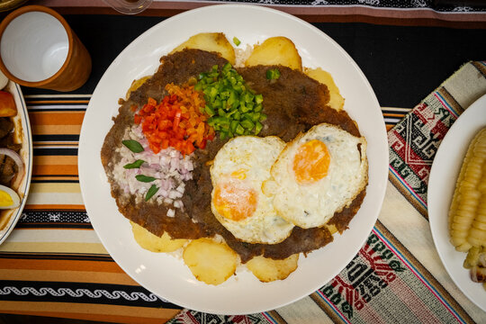 traditional bolivian food from cochabamba called silpancho with egg - traditional food concept