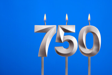 Birthday candle number 750 - Celebration card on blue background