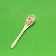Sagu starch balls - Tapioca pearls on the spoon. Manihot esculenta.