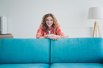 Photo of cheerful adorable cute woman buy new comfortable apartment furniture store sale