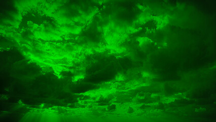 A surreal and intense natural background with clouds enveloped in a vivid green hue. Perfect for 4K wallpapers, banners, and unique creative backdrops