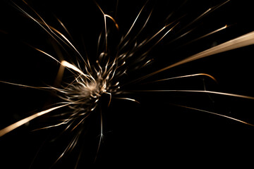 sparks from the grinder glowing in the dark