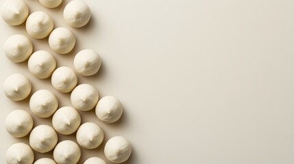 A monochrome flat lay arrangement of a diagonal line of white chocolate truffles  AI generated illustration
