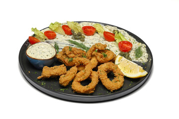 plate of squid on isolated white background. With sauces.