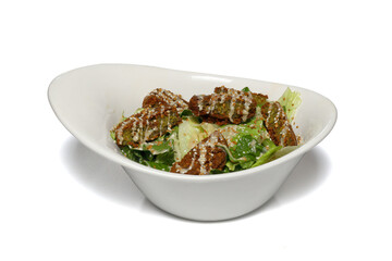 Plate of traditional grilled meatballs on white background