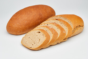 Whole wheat bread loaf sliced, showcasing its hearty texture and rich, wholesome flavor