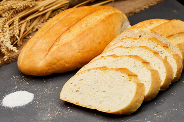 Golden, freshly sliced loaf of homemade bread, perfect for sandwiches, breakfast, or toasting