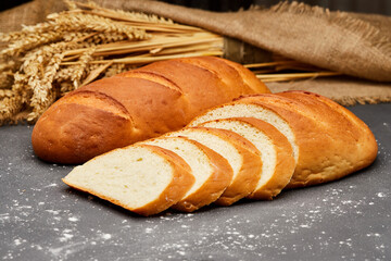 Golden, freshly sliced loaf of homemade bread, perfect for sandwiches, breakfast, or toasting