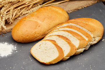 Freshly baked white bread loaf, sliced and ready to serve, perfect for sandwiches and breakfast