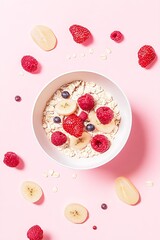 Oatmeal with Raspberries  Banana  and Strawberries on Pink Background