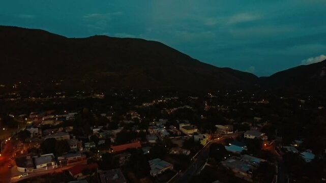 Flying over a ghetto in Jamaica at sundown