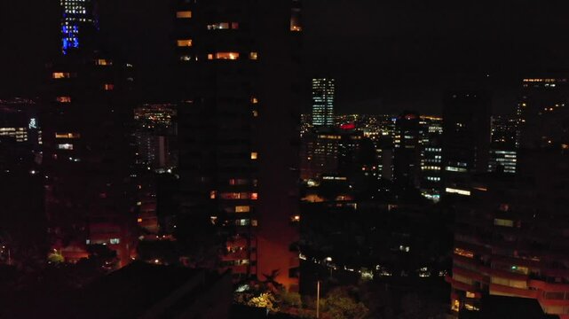 Aerial view of streets and buildings of Macarena, Bogota Colombia at Night 6