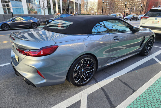 New York City, USA - March 11, 2024: BMW M8 convertible luxury solver car parked outdoor, back side view