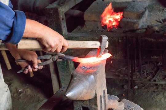 Europe, Romania. Viscri. Local Gypsy blacksmith.