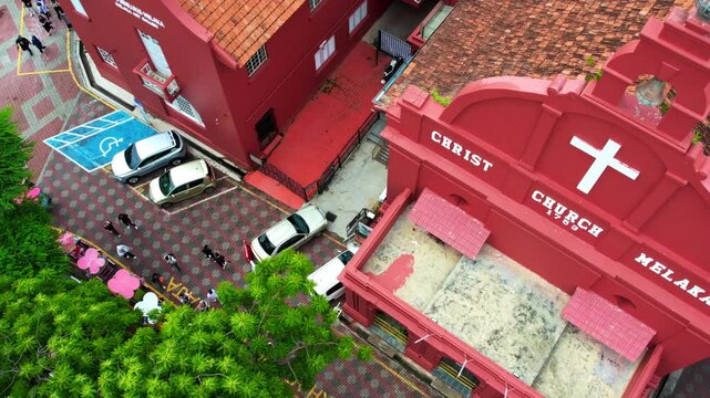 Melaka, Malaysia - July 6, 2023 Aerial view of The oriental red building in Dutch Square, Malacca, 4K slow-motion