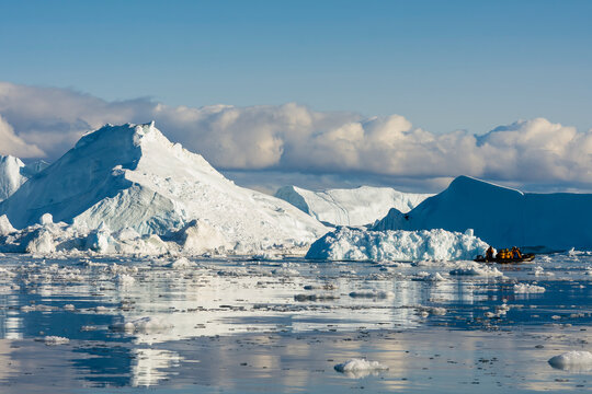 Greenland. Ilulissat. Icebergs and brash ice in the Icefjord.