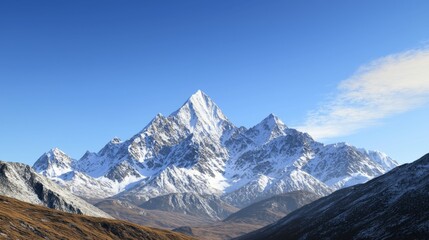 Obraz premium Majestic mountain range with snow-capped peaks and clear blue sky above. Majestic Mountain Range