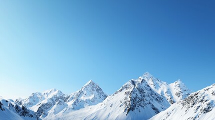 Majestic mountain range with snow-capped peaks and clear blue sky above. Majestic Mountain Range