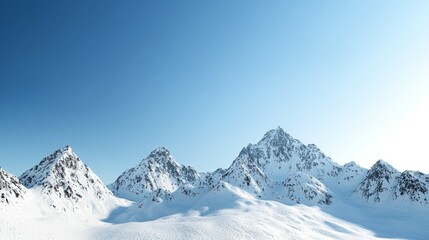 Obraz premium Majestic mountain range with snow-capped peaks and clear blue sky above. Majestic Mountain Range