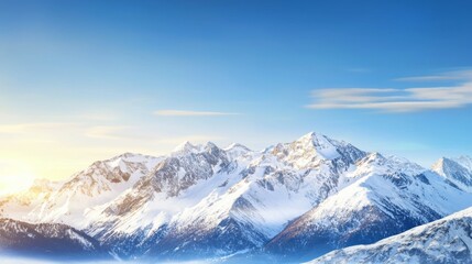 Majestic mountain range with snow-capped peaks and clear blue sky above. Majestic Mountain Range