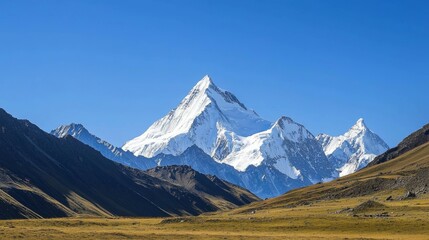 Majestic mountain range with snow-capped peaks and clear blue sky above. Majestic Mountain Range