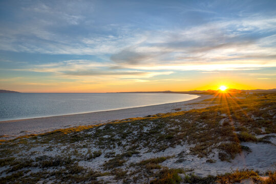 Mexico, Baja California Sur. La Ventana, sunrise over Sand Dune and Sea of Cortez