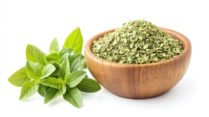 A wooden bowl filled with dried oregano flakes, accompanied by fresh oregano leaves, beautifully arranged and isolated on a white background.