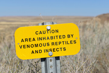 USA, Arizona, caution area inhabited by venomous reptiles and insects sign, Homolovi State Park