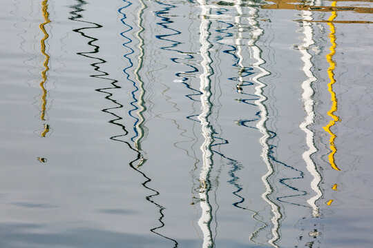 USA, California, San Diego. America's Cup Harbor, sailboat mast reflections