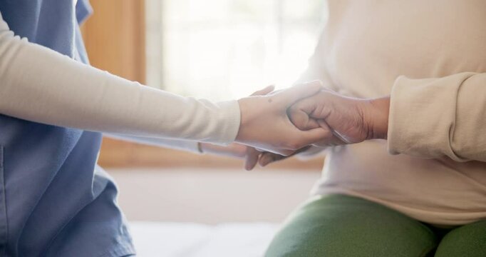 Physiotherapist, holding hands and closeup for support in clinic with care, empathy and kindness on bed. Doctor, nurse and consultation for rehabilitation, recovery and healthcare in room at hospital
