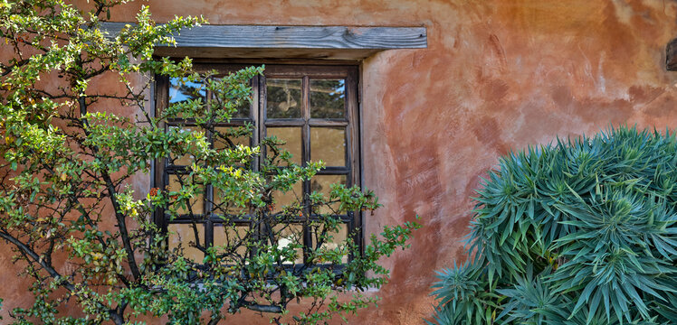 USA, California, Carmel. Window and stucco wall Carmel Mission