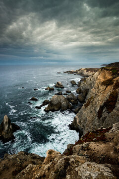 USA, California. Clouds approaching the cliffs and surging waves at Bodega Head, Sonoma Coast State Beach (Large format sizes available)