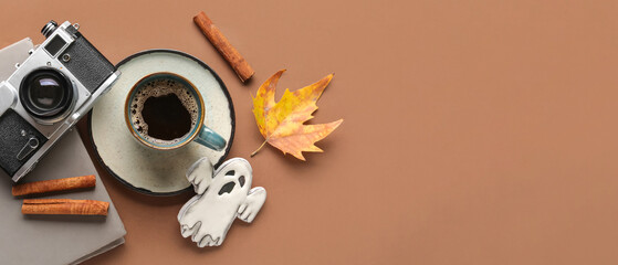 Composition with cup of aromatic coffee, book and vintage photo camera on color background