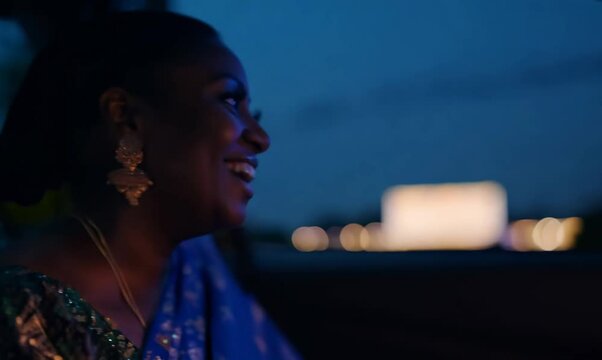 Nigerian Woman Enjoying Movie at Drive-In Theater