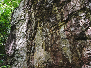 Tham Tarn Lod Noi Cave surrounded by lush green forest, nature trail at Chalerm Rattanakosin National Park, Kanchanaburi, Thailand.