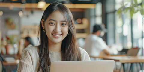 Contented Female College Student Engaged in Online English Learning Through Laptop Webinars and Tutorials