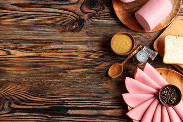 Plates with slices of tasty boiled sausage, bread and mustard sauce on brown wooden background © Pixel-Shot
